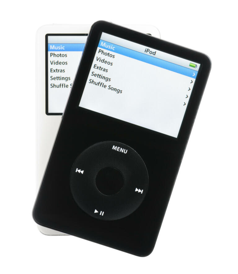 Colorado Springs, Colorado, USA - May 25, 2011: A pair of black and white iPods fanned out over a white background. Both iPods are displaying their home screens. The iPods in this photo are fifth generation Apple iPods. This model was the first iPod with video playback capabilities.