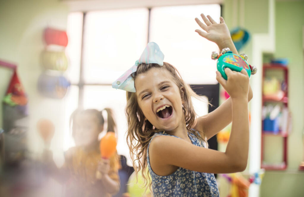 Dancing to their own tune. Child in music school.