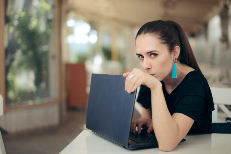 Girl trying to keep her internet data confidential typing password in secret