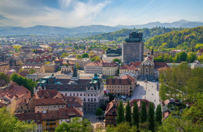 Panoramic view of Ljubljana city center from castle hill, Ljubljana, Slovenia. The main building of the University of Ljubljana and Congress square