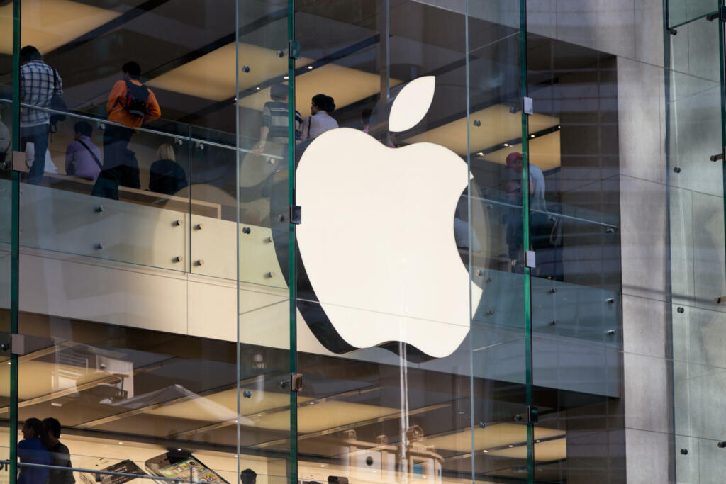 "Sydney, Australia - November 4, 2011: Apple Computers logo and shoppers at the Apple Store in Sydney, Australia."