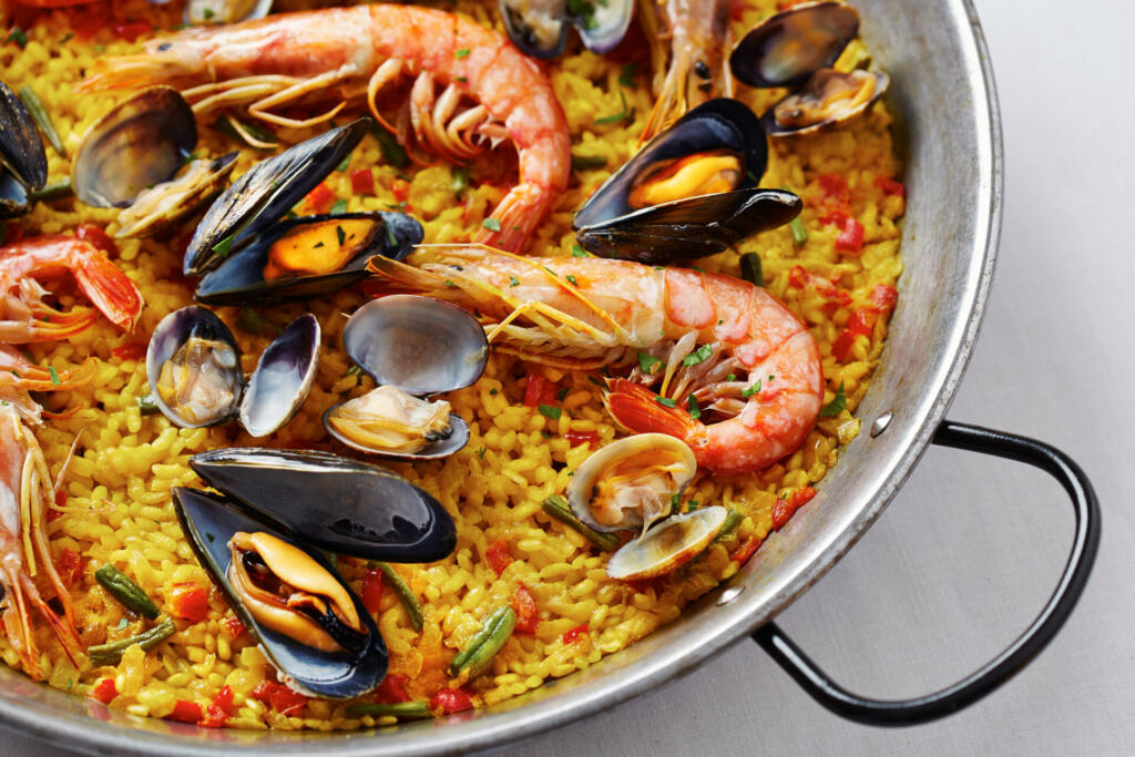Typical spanish seafood paella in traditional pan