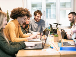 Young people in co-working creative space - Youth millennial generation and business technology concept