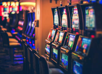 Ko kockanje postane navada Rows of Casino Slot Machines with Shallow Depth of Field. Las Vegas Gambling Theme.