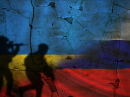 Russia vs Ukraine flag on cracked wall, concept of war between russia and ukraine, silhouette of soldiers on russia vs ukraine flag