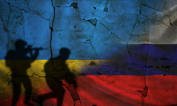 Russia vs Ukraine flag on cracked wall, concept of war between russia and ukraine, silhouette of soldiers on russia vs ukraine flag