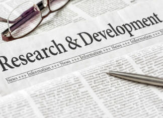 Društvo združuje mlade raziskovalce … A newspaper with the headline Research and Development