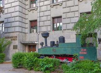 Belo mesto – Beograd Belgrade, Serbia - May 13, 2022: Old Steam Powered Locomotive in Front of Railway Museum Building Capital City.