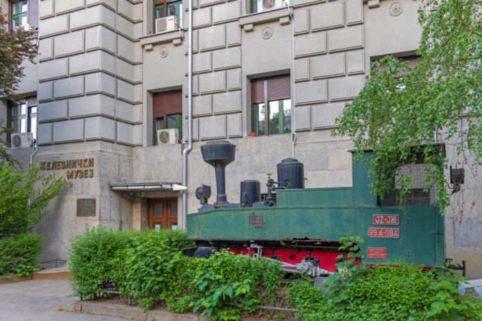 Belgrade, Serbia - May 13, 2022: Old Steam Powered Locomotive in Front of Railway Museum Building Capital City.