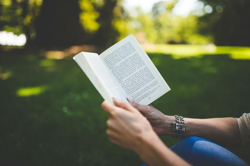 book, woman, park