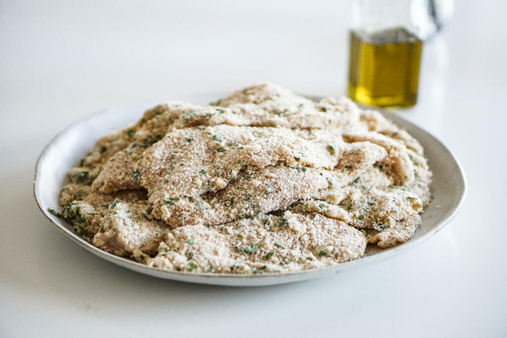 Breaded chicken on white plate