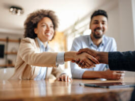 Business partners, completing the paperwork, for their new company.