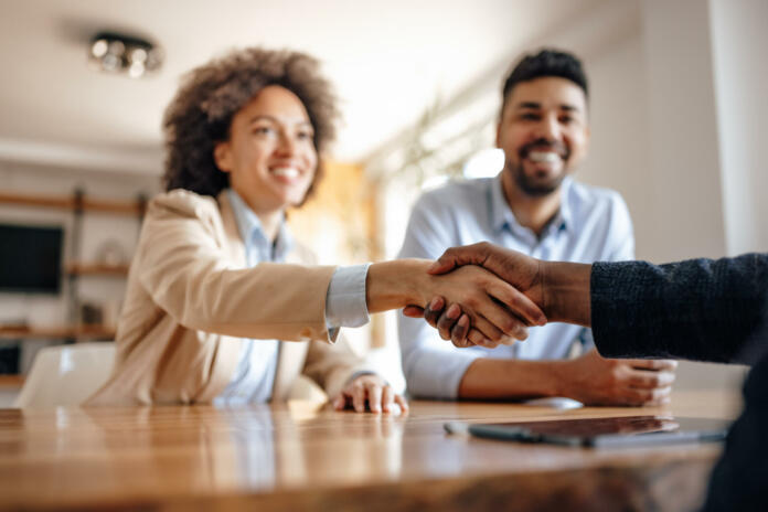 Business partners, completing the paperwork, for their new company.