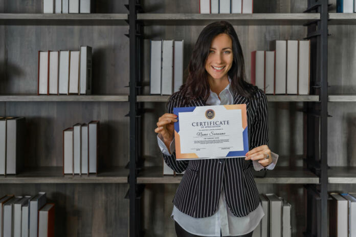business portrait of caucasian business woman posing with certificate of appreciation recieved from business performace competition award winning