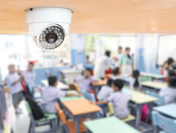 CCTV Security monitoring student in classroom at school.Security camera surveillance for watching and protect group of children while studying.