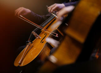 2Cellos in Moon River Cellos and musicians during a concert with an orchestra