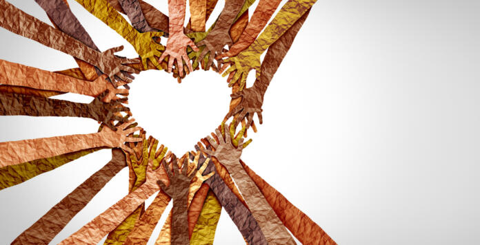 Diverse hands heart and united diversity or unity partnership in a group of multicultural people connected together shaped as a support symbol expressing the feeling of teamwork and togetherness.