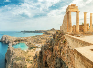 Svobodni Rodos Famous tourist attraction - Acropolis of Lindos. Ancient architecture of Greece. Travel destinations of Rhodes island