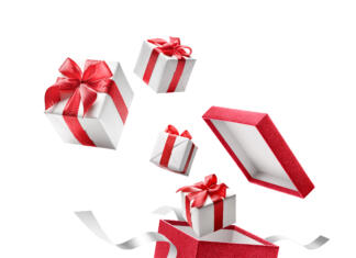 ZATO! pomagam za oba Gifts bursting out from red open gift box over white background