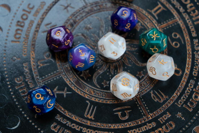 Horoscope zodiac circle with divination dice. Fortune telling and astrology predictions concept, magic rituals and exoteric experience