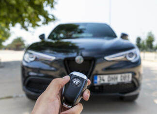 Julija in alfa Romeo Istanbul, Turkey - July 13 2021 : The New Alfa Romeo Stelvio is the new optimal performance and utility SUV. It has wireless car key.