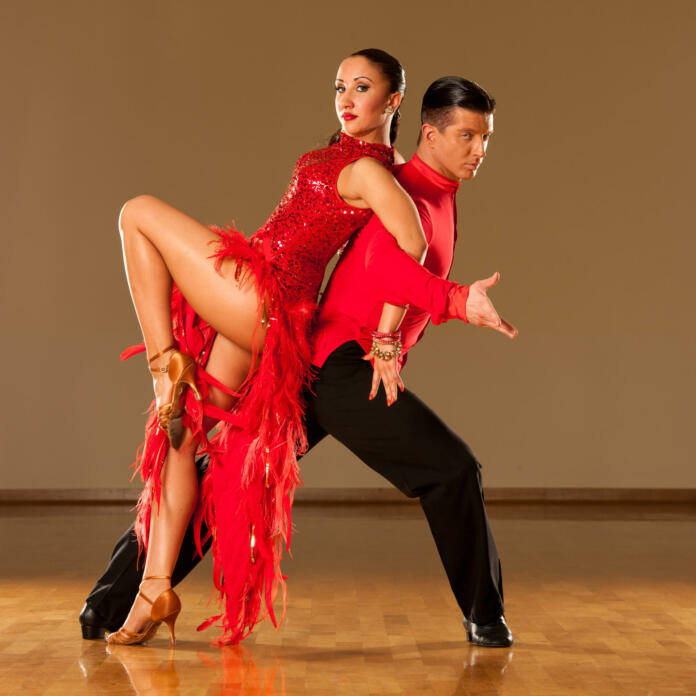 latino dance couple in action - dancing wild samba