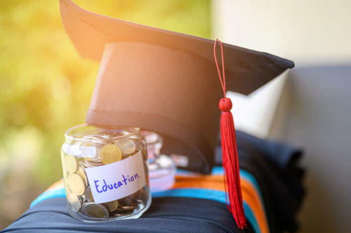 Money for education placed in a glass jar