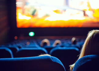 Gremo mi po svoje pelje slovenski film v svojo smer Movie theater during the screening of an animated movie.