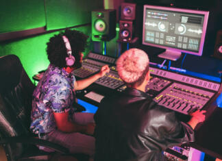 OPM, legendarna ameriška skate surf pop punk zasedba prvič v Ljubljani Musician and sound engineer mixing new album inside boutique recording studio - Technology and music industry concept - Main focus on man head