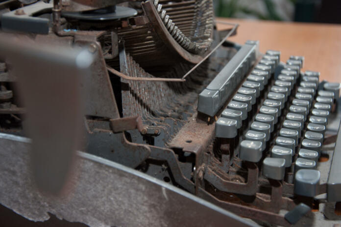 old rusty abandoned typewritter in office