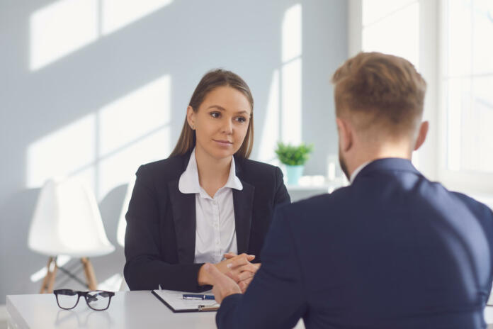 Recruitment of people. Applicant man at the interview in the office.