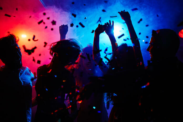 silhouettes-of-dancers-moving-in-confetti-stockpack-istock Silhouettes of dancers moving in confetti