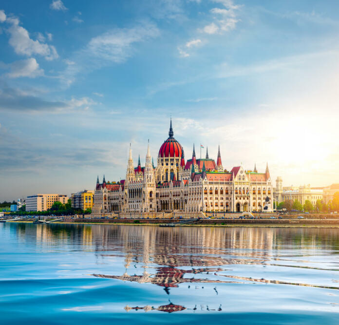 Sun over Parliament in Budapest at sunset, Hungary