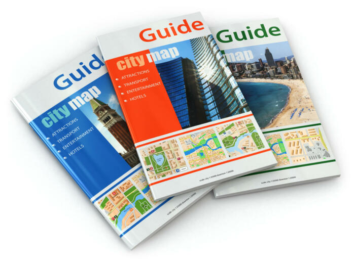 Travel guide books on white isolated background. 3d