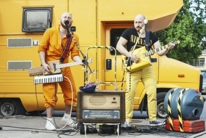 Vilnius, Lithuania - May 18, 2019: Eccentric two man rock band with handmade musical instruments performing on the street at traditional street music day in Vilnius, Lithuania