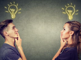 Young people man and woman posing together enlightened with idea looking positive.