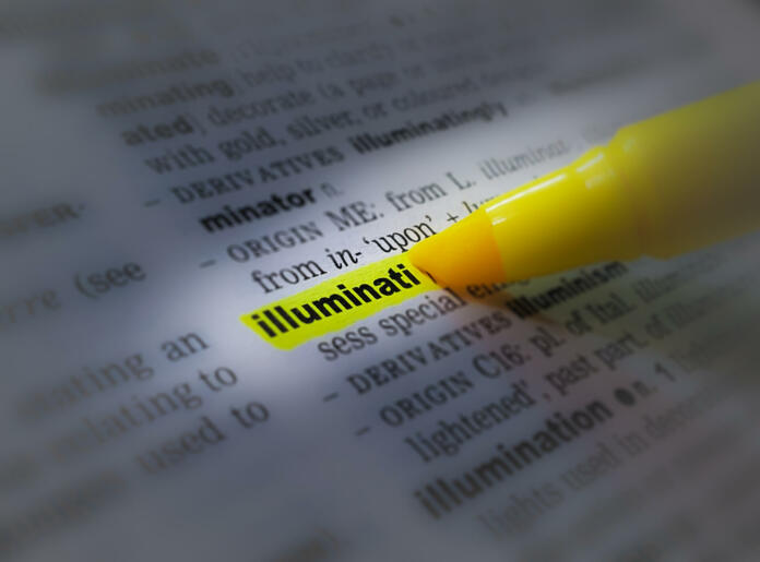 A close up of the word: Illuminati in a dictionary, highlighted in yellow and showing part of its definition.