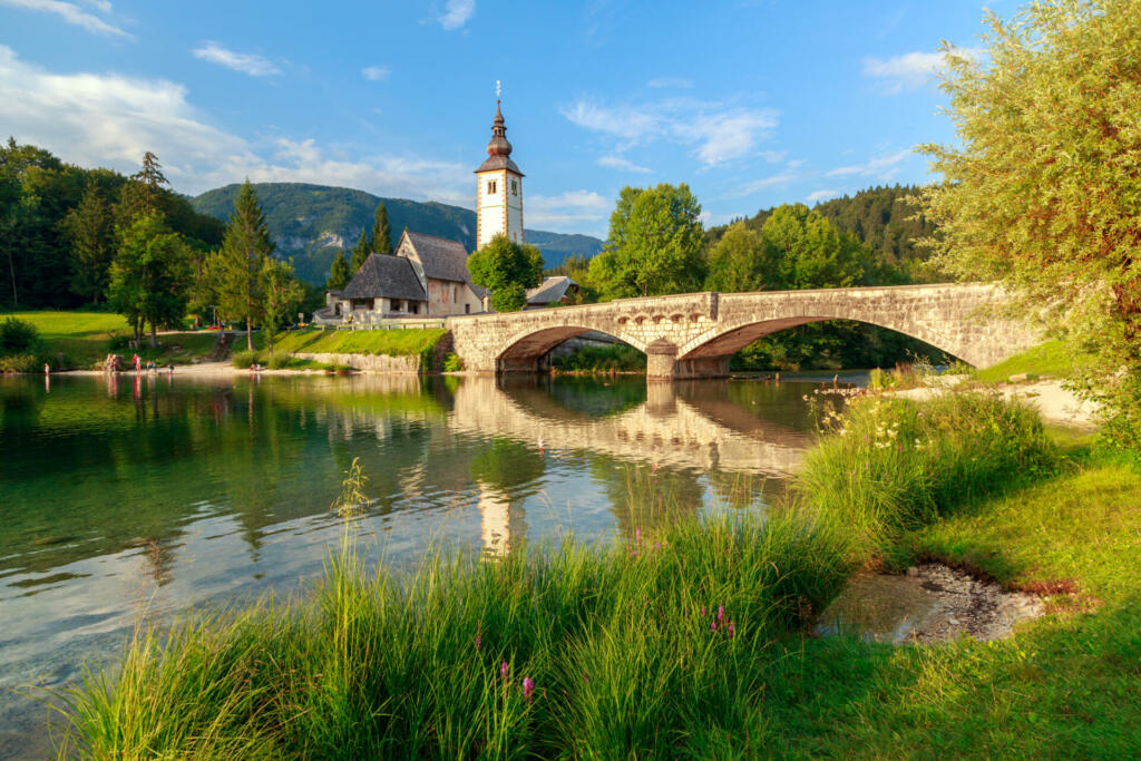 Church of Sv. John the Baptist and a bridge by the Bohinj lake, Slovenia