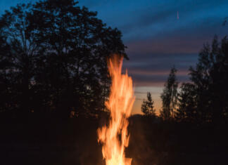 Kresovanja close-up fire, large burning blocks of wood and flames of red fire at the summer solstice