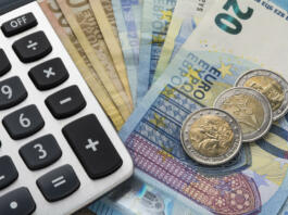 Close up of a calculator and euro money in a financial analyzing concept