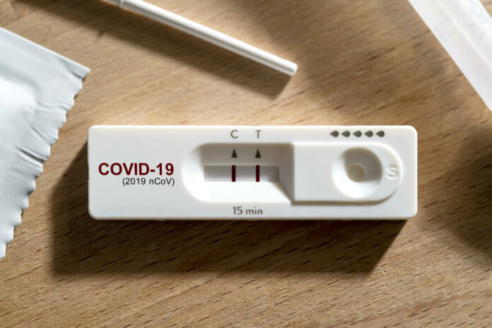 close up positive show result of covid infected show on nasal rapid self test kit at home