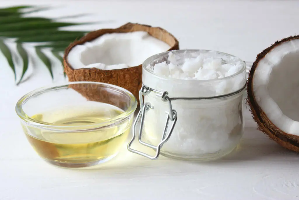 coconut oil and coconuts, palm branches close up. High quality photo