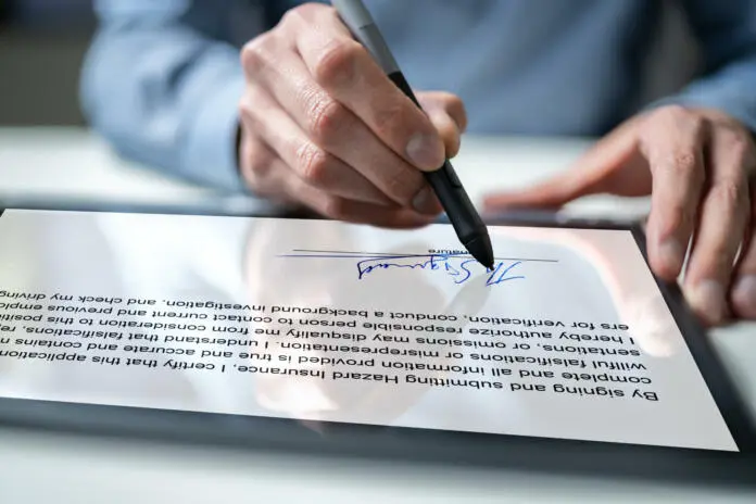contract-e-signature-employee-signing-law-document-stockpack-istock Contract E Signature. Employee Signing Law Document