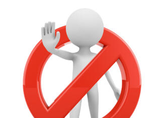 Zlatko v pesmi Svoboda: »Stop janšizmu, svoboda vsem.« Faceless man with red stop sign on a white background. 3d render.