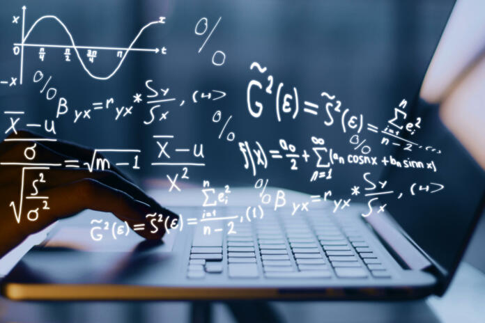 Hands using laptop with mathematical formulas. Online education concept