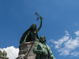 Ljubljana, Slovenia, Europe - June 24, 2018: view of the Prešeren Monument in Ljubljana, a late Historicist bronze statue of the Slovene national poet France Prešeren (1800-1849) by Ivan Zajec in Prešeren Square
