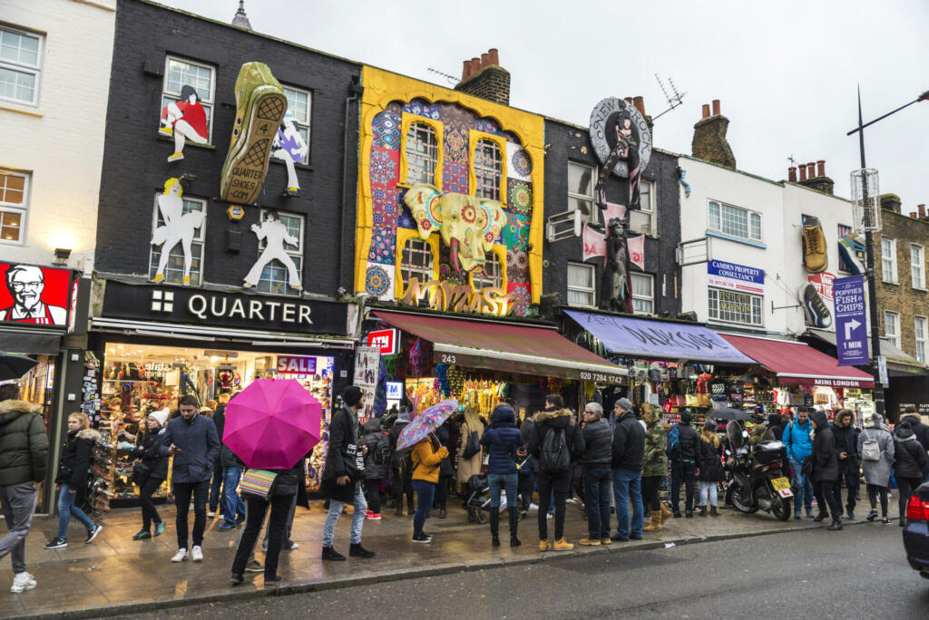 London, England UK - December 31, 2017: People walking down the fashion shops of Camden High Street in Camden Lock or Camden Town in London, England, United Kingdom