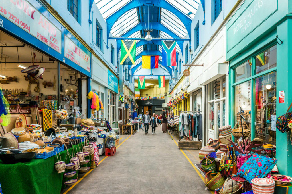 London, United Kingdom - May 14, 2016: Brixton Village and Brixton Station Road Market. Colorful and multicultural community market run by local traders in South London.