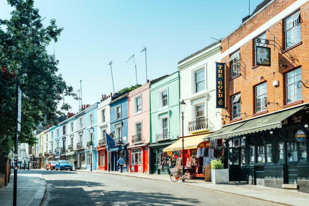 London, United Kingdom - May 25, 2017 : Portobello Road is a street in the Notting Hill district of the Royal Borough of Kensington and Chelsea in west London. It runs almost the length of Notting Hill from south to north, roughly parallel with Ladbroke Grove. On Saturdays it is home to Portobello Road Market, one of London's notable street markets, known for its second-hand clothes and antiques.