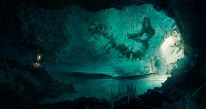 Man (explorer) discovering a large frozen fossil inside a beautiful ice cave
